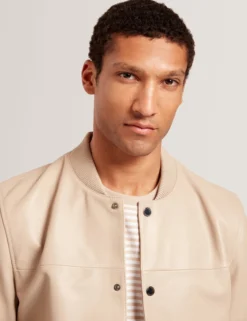 Klassische Bomberjacke aus taupefarbenem Leder