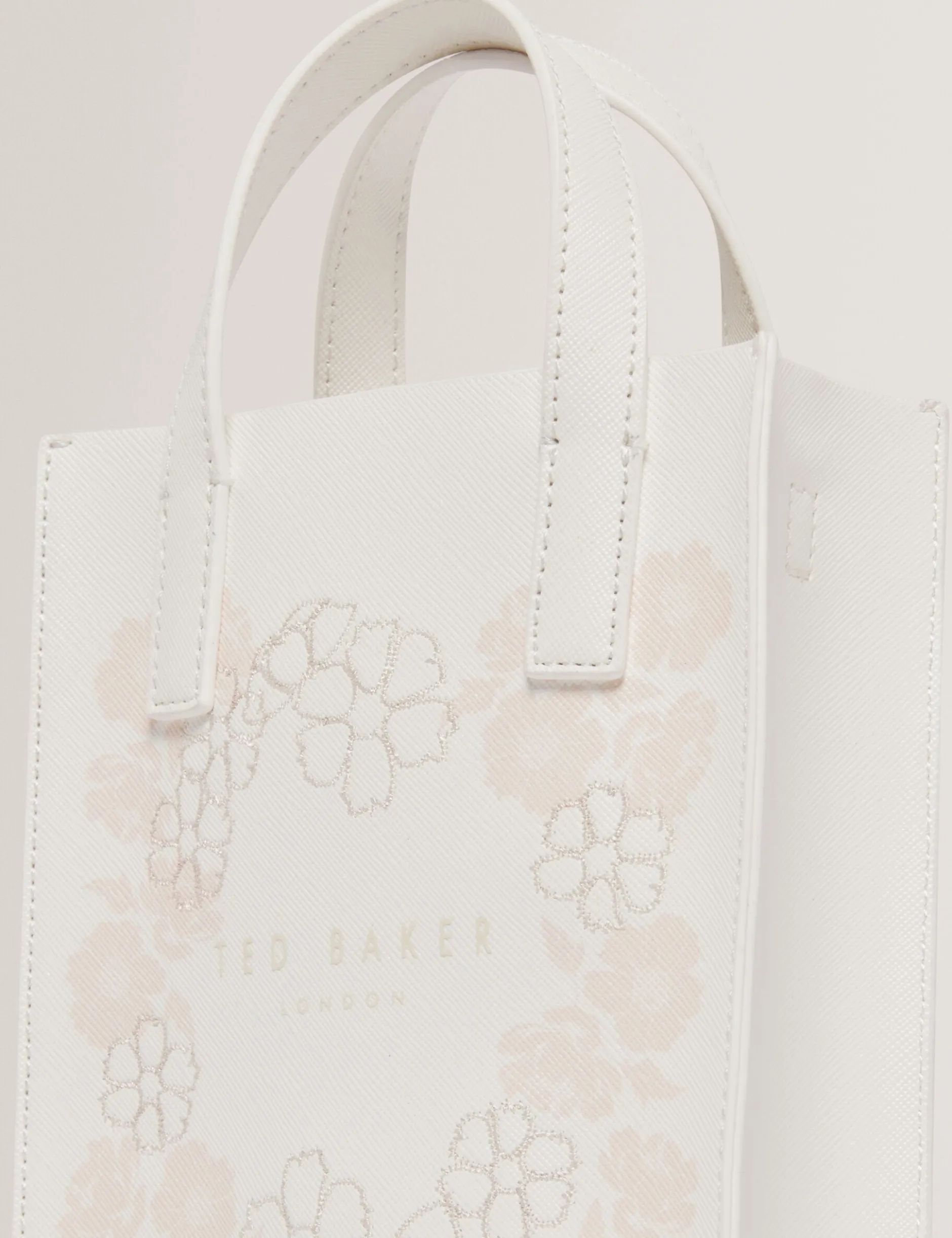 Kleine Tragetasche mit Blumenstickerei und Icon-Muster