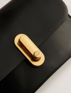 Kleine Umhängetasche aus Leder mit Drehverschluss