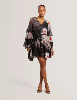 Minikleid mit Lilienmuster, Rüschen und langen Ärmeln