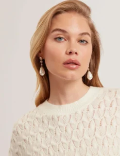 Pointelle Zopfstrickpullover aus Wolle