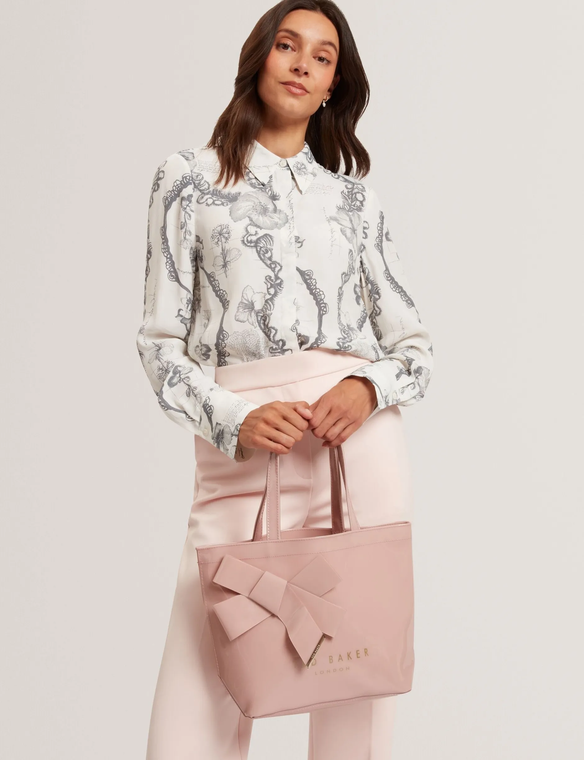 Tragetasche mit kleinem Knoten-Schleifen-Vinyl-Symbol